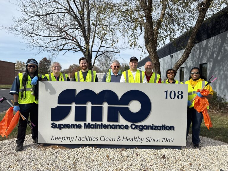 Supreme Maintenance Organization volunteers participating in Adopt-a-Street cleanup event, promoting clean and healthy facilities since 1989.