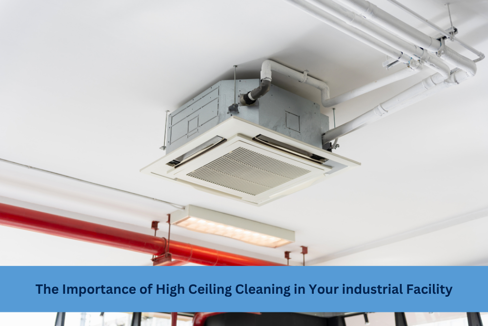 Industrial ceiling with HVAC unit, pipes, and sprinkler system highlighting the need for high ceiling cleaning in large facilities.