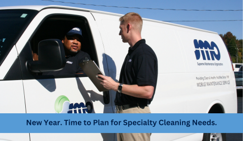 SMO technician speaking with a team member beside an SMO service van while preparing for New Year specialty cleaning services
